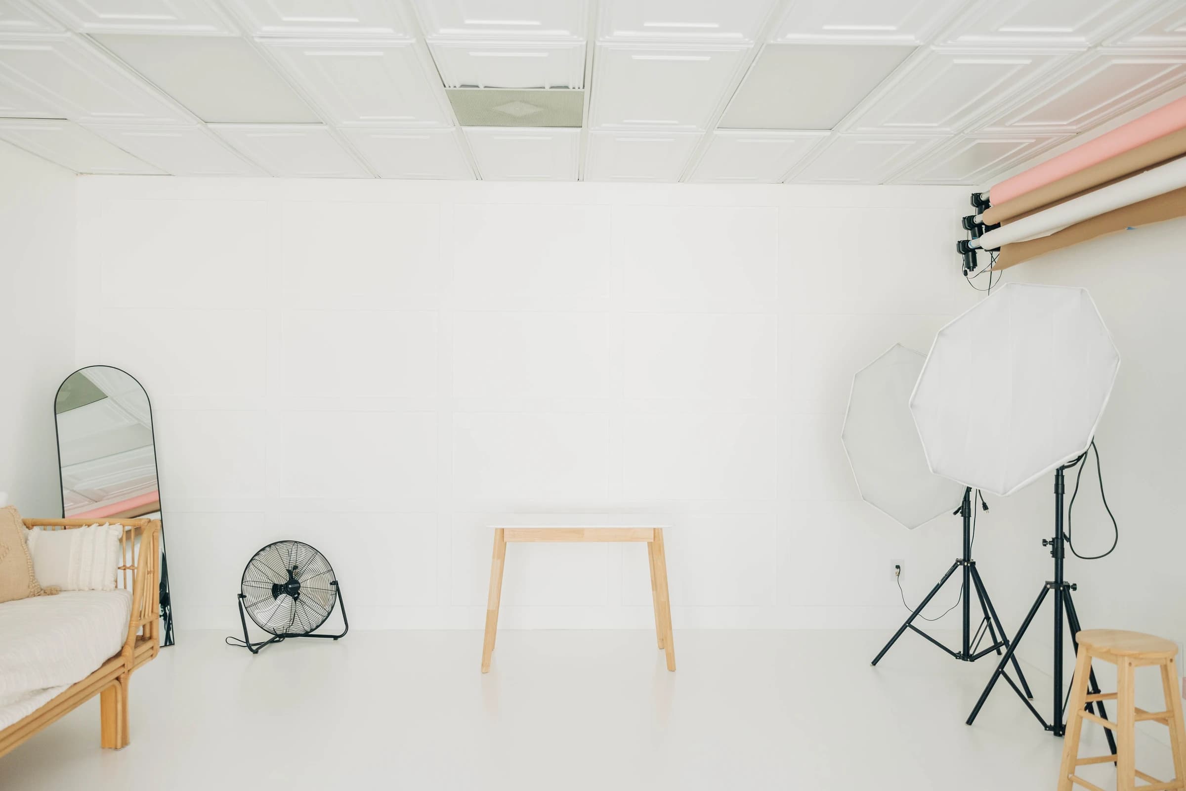 A Godox octagon softbox on its stand, ready beside the seamless backdrop
