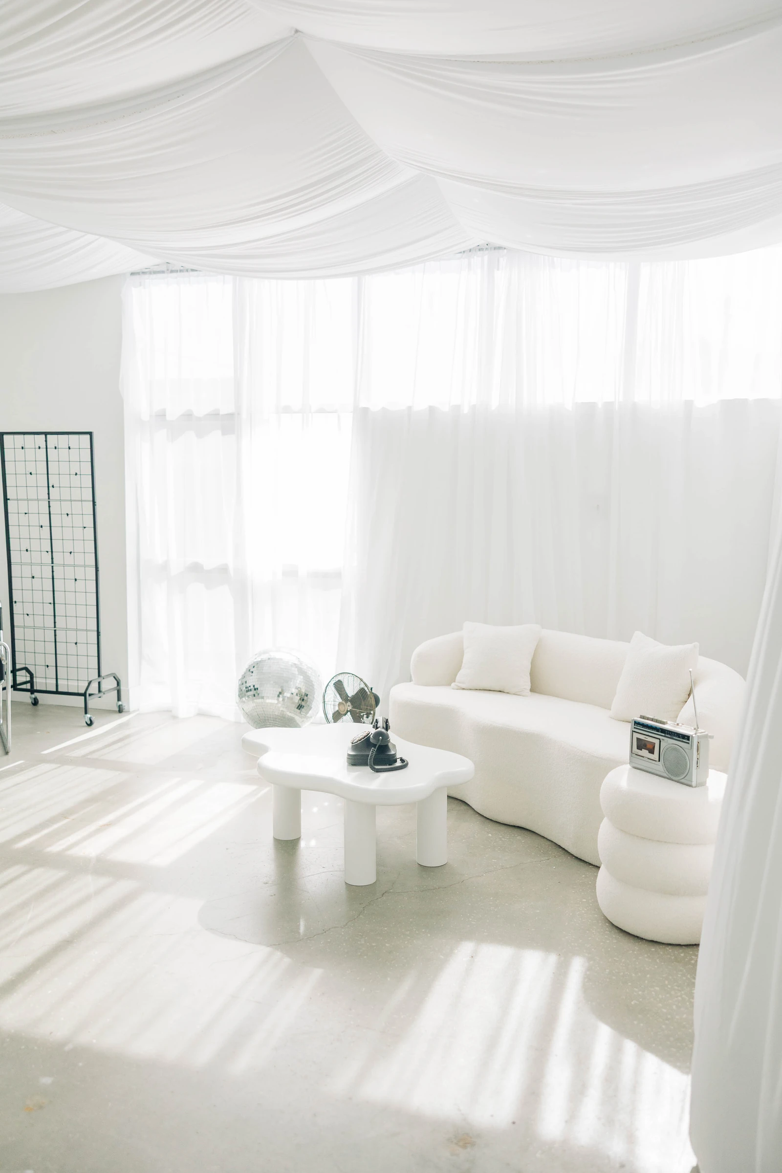 Clean, even daylight through the sheer curtains of Studio B, ready for a branding session