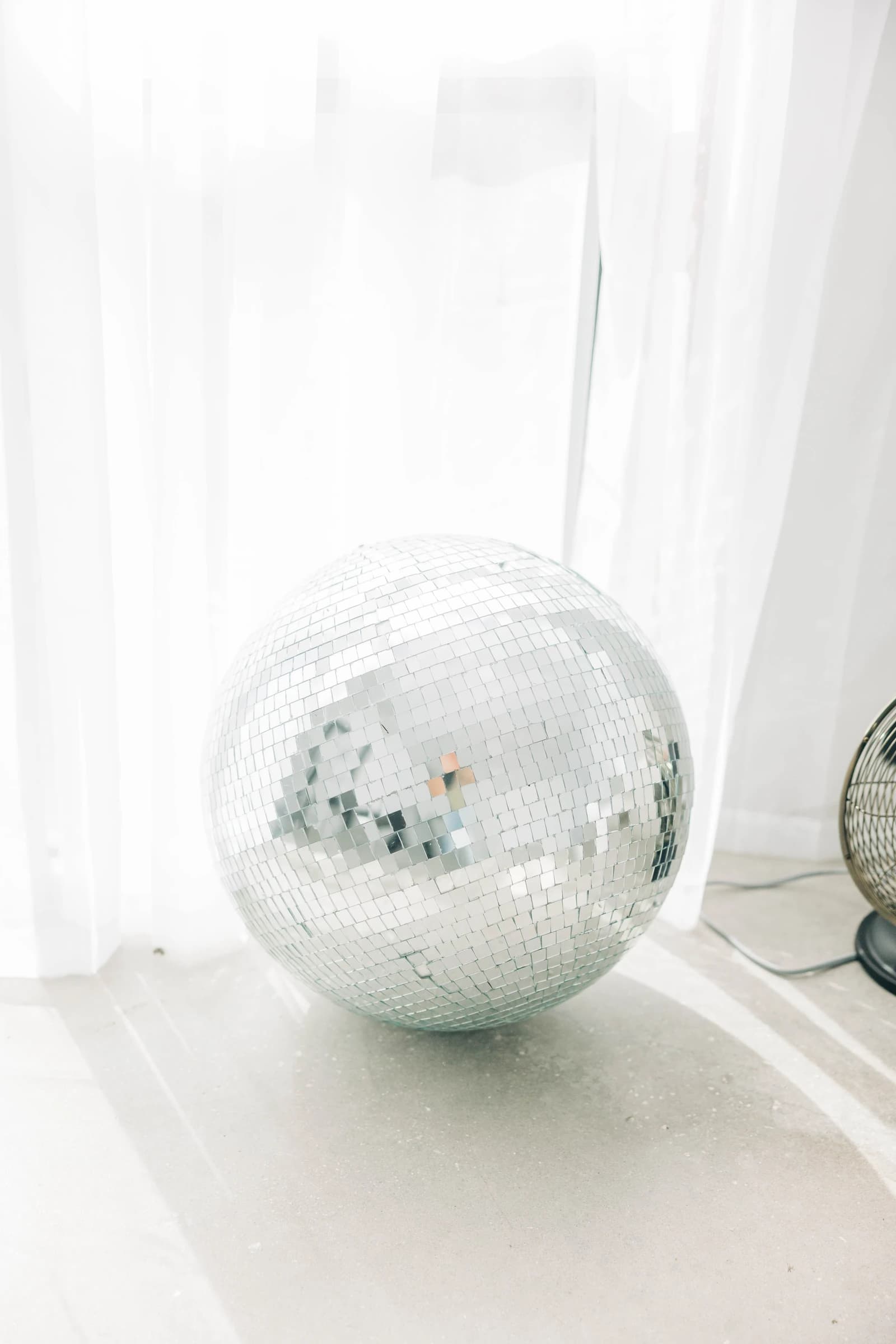 The disco ball under Studio B's draped ceiling